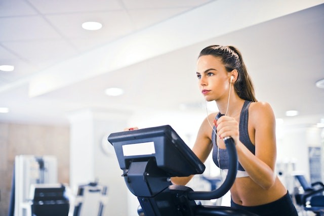 a-girl-is-doing-exercise-on-crosstrainer