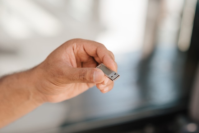 man-holding-usb-drive