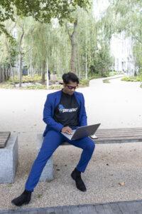 Digital-entrepreneur-working-remotely-living-the-laptop-lifestyle-while-managing-online-businesses